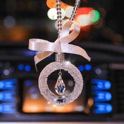 Sparkling crystal star pendant for car rearview mirror with silver alloy chain reflecting sunlight