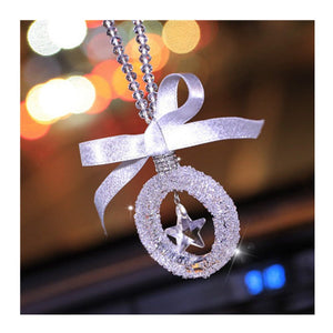 Sparkling crystal star pendant for car rearview mirror with silver alloy chain reflecting sunlight