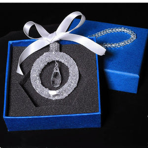 Sparkling crystal star pendant for car rearview mirror with silver alloy chain reflecting sunlight
