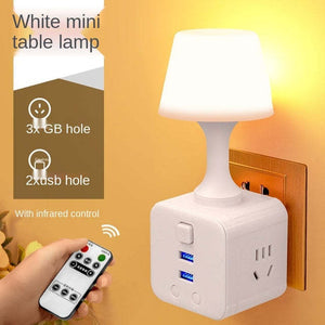 Minimalist cup-shaped LED night light in white with remote control and USB port for phone charging