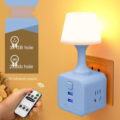 Minimalist cup-shaped LED night light in white with remote control and USB port for phone charging