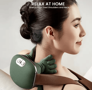 Close-up of a lightweight grey neck and shoulder massager with dual-palm kneading nodes on a soft-touch fabric surface.