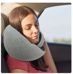 Grey memory foam U-shaped travel pillow with 360-degree neck support and travel sleep accessories.